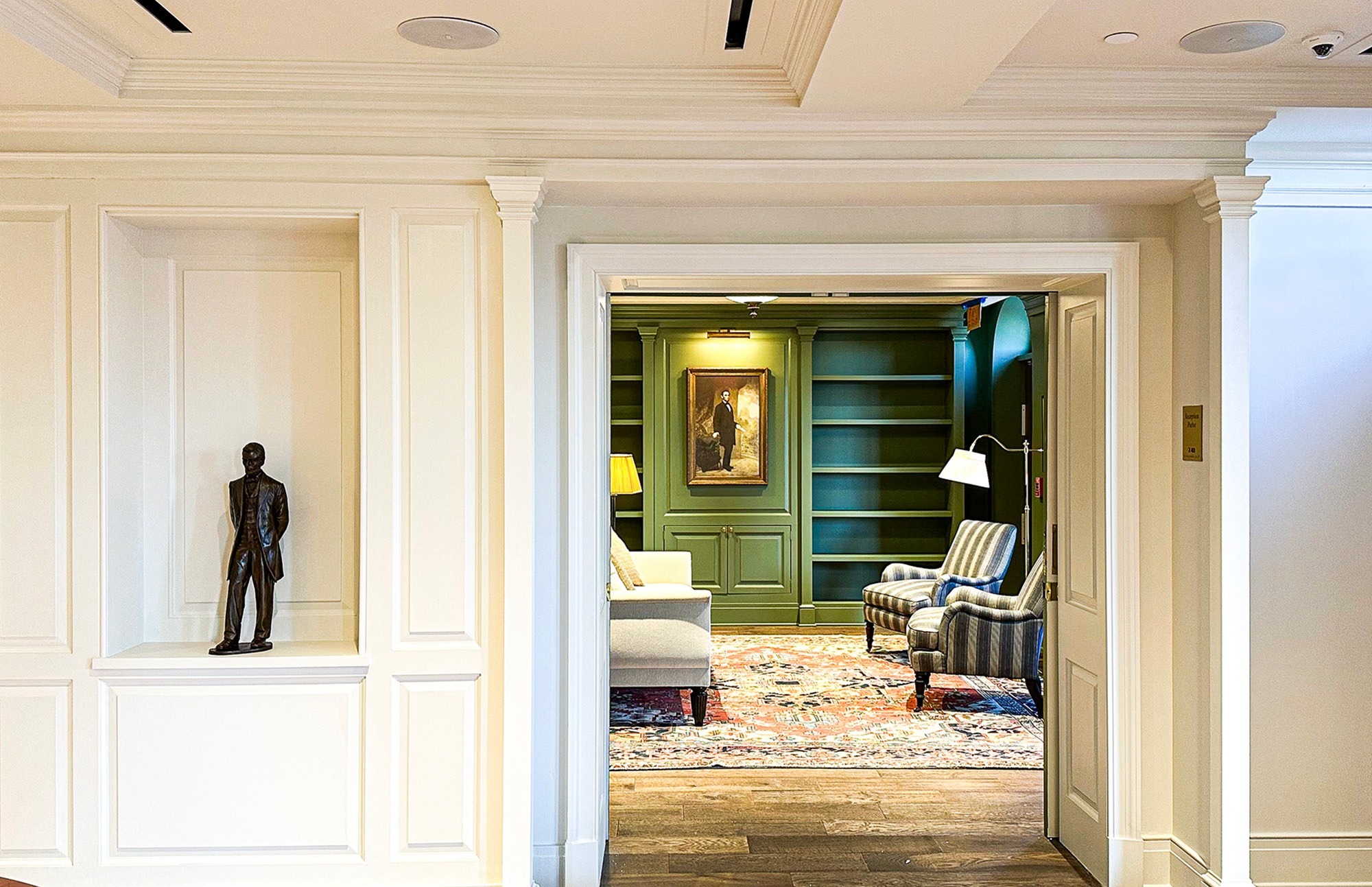 Looking into green room with painting of Lincoln